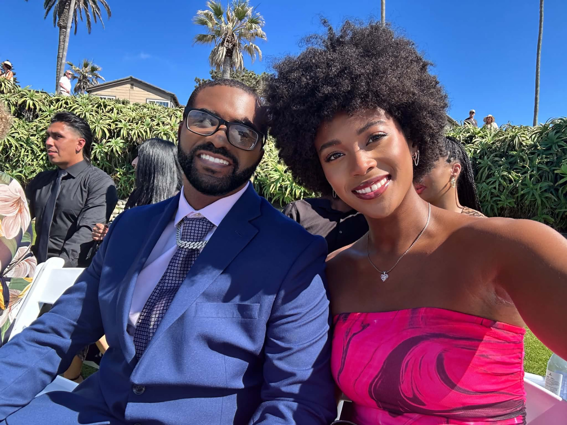 Donye'a and Kyra dressed up at a seaside wedding