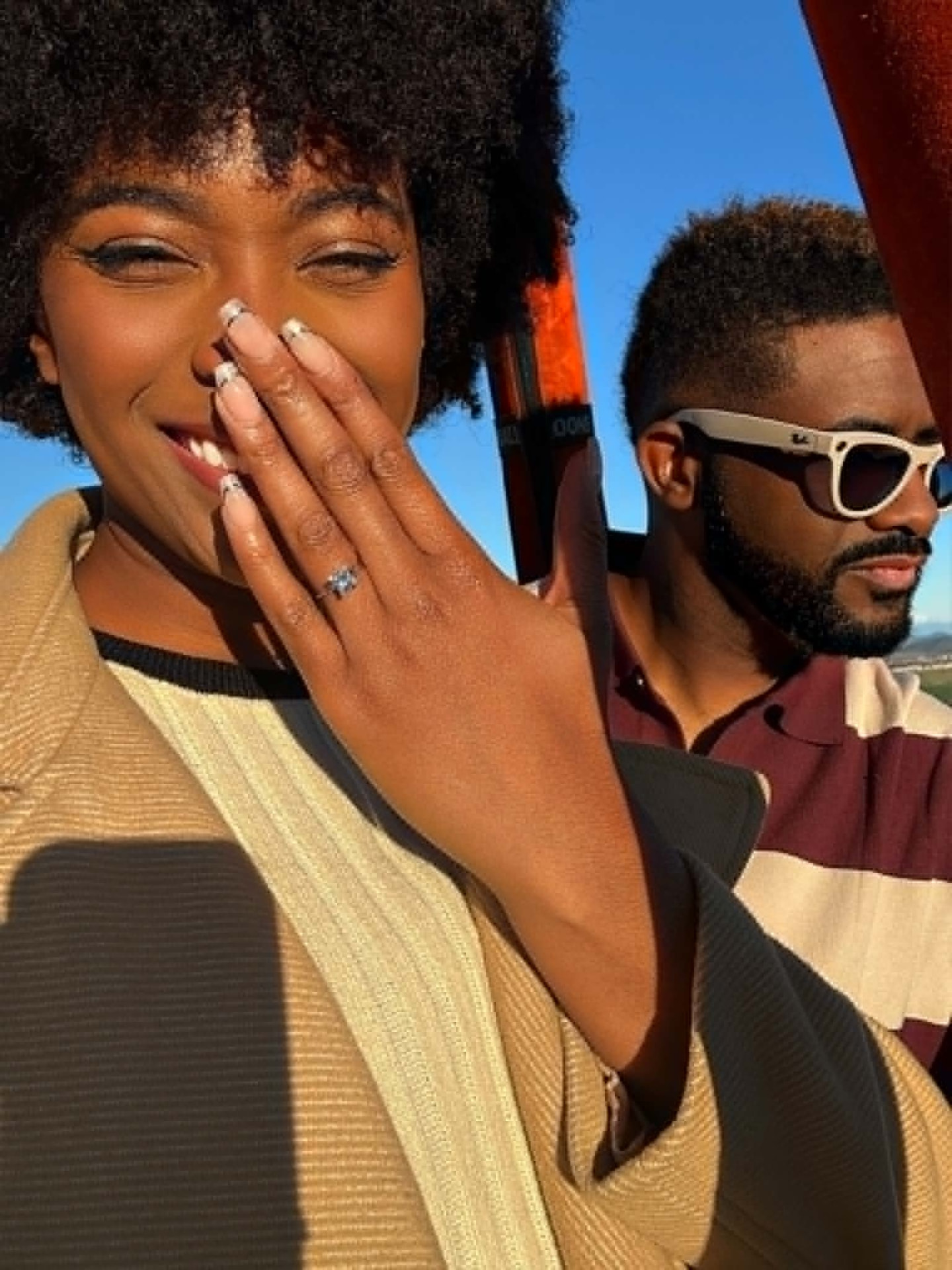 Kyra smiling with her engagement ring during the hot air balloon proposal